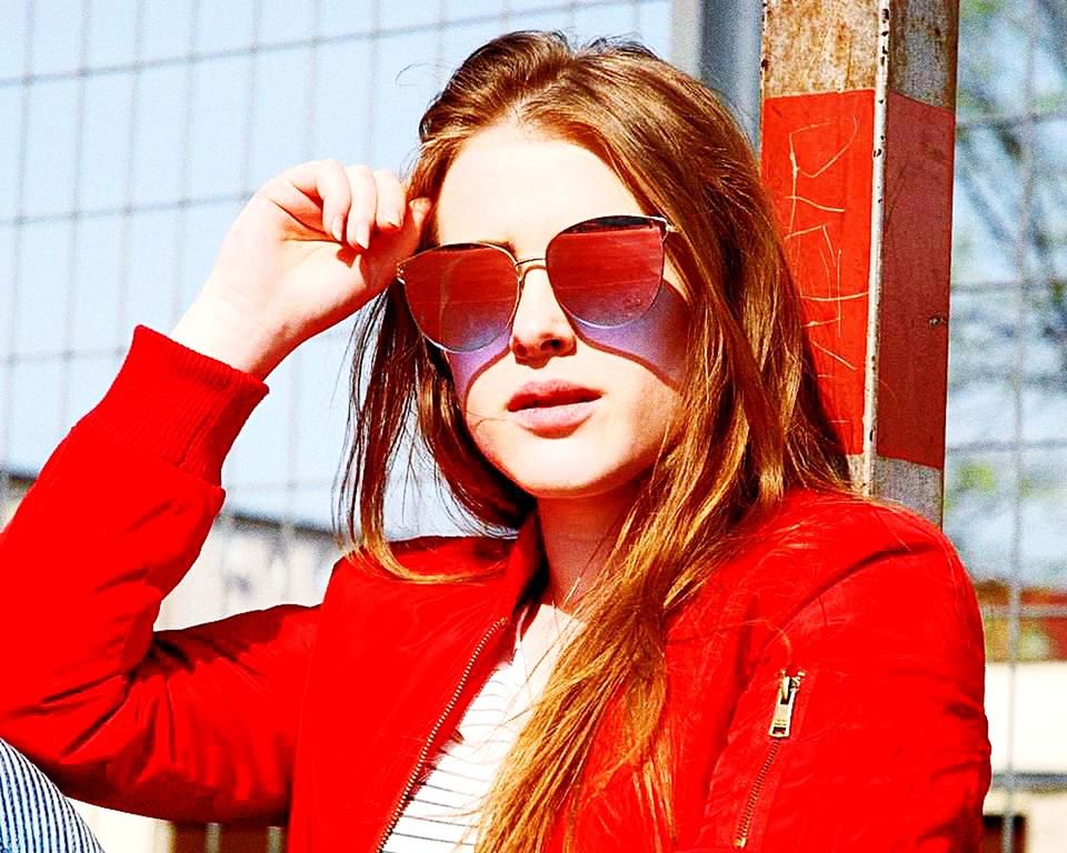 one person, headshot, young adult, sunglasses, portrait, glasses, real people, fashion, beautiful woman, young women, lifestyles, hairstyle, adult, front view, red, long hair, beauty, women, hair, outdoors, warm clothing