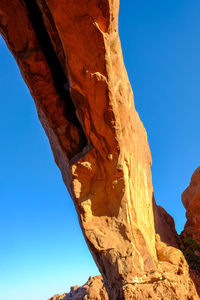 Low angle view of mountain against clear blue sky