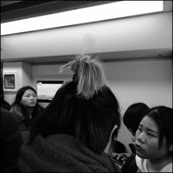 Portrait of friends sitting in corridor