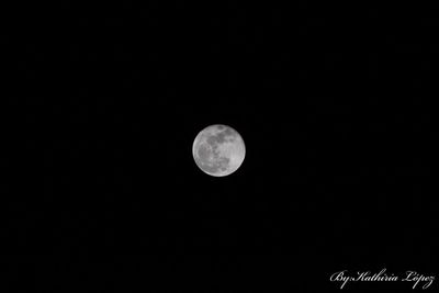 Low angle view of moon against clear sky at night