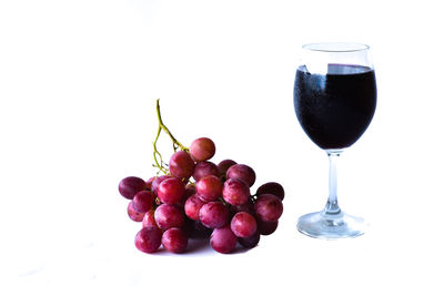 Close-up of grapes against white background