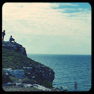 Scenic view of sea against cloudy sky