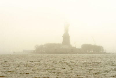 Statue in foggy weather