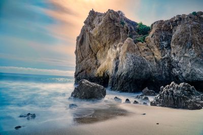 Scenic view of sea against sky at sunset