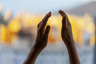 Close-up of hand against blurred background