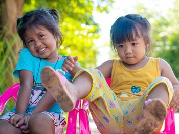 Portrait of happy girl and daughter outdoors
