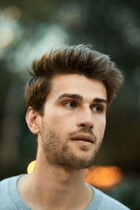 Close-up of young man looking away