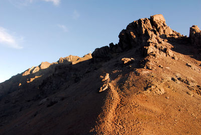 Rock formation on land against sky