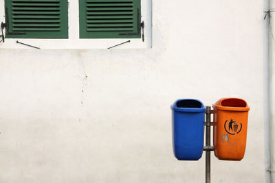 Garbage bins against wall