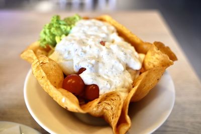 Close-up of breakfast served in plate on table