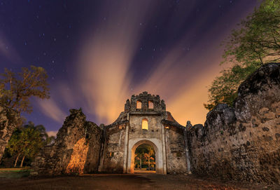 View of old building against sky at night