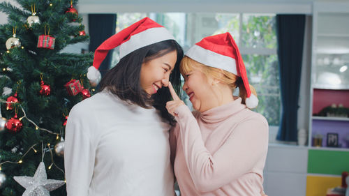 Woman with umbrella on christmas tree