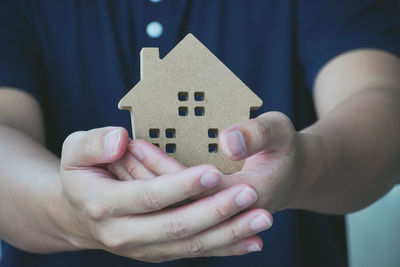 Close-up of man holding hands