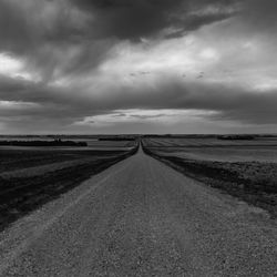 View of road against cloudy sky