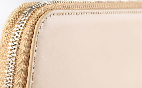 Close up of purse against white background