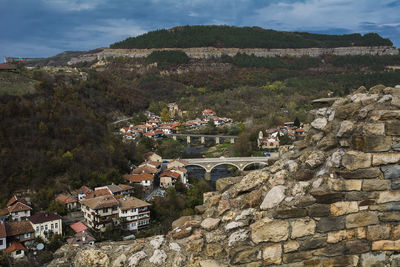 Houses in town against sky