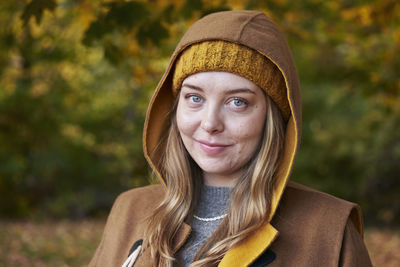 Portrait of young woman wearing hat