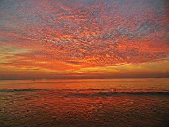 Scenic view of sea against dramatic sky