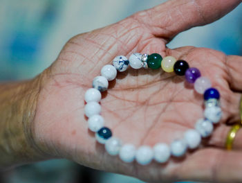 Close-up of woman hand holding bracelet