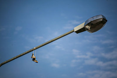 Low angle view of street light against sky