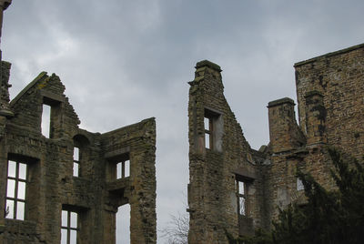 Low angle view of old building against sky