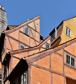 Low angle view of buildings against clear sky