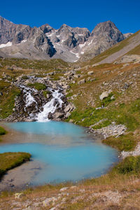 View of river flowing through mountains