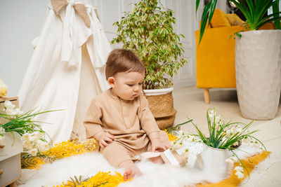 Portrait of girl playing with christmas tree