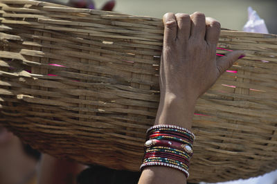 Close-up of woman holding wicker basket