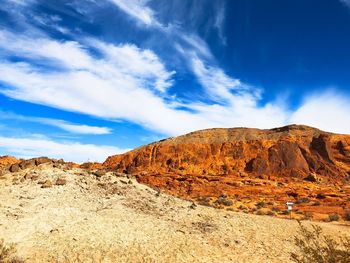 Rock formations in desert against blue sky