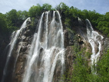 Scenic view of waterfall on mountain