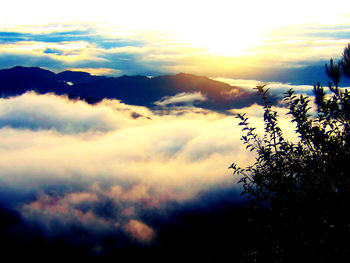 Scenic view of mountains against sky at sunset