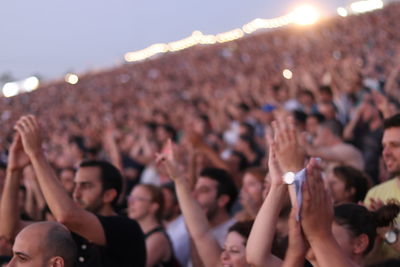 People enjoying music concert at night