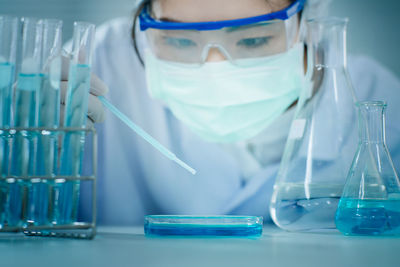 Scientist doing scientific experiment in laboratory