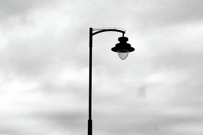 Low angle view of street light against sky