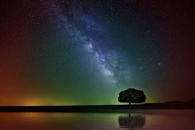 Scenic view of sea against star field