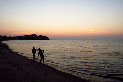Scenic view of sea at sunset