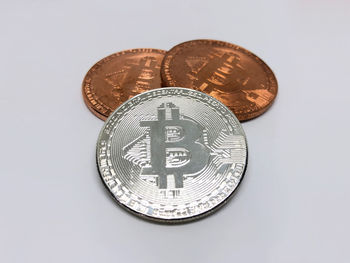 Close-up of coins on white background