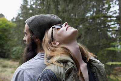 Young couple hanging out in the forest