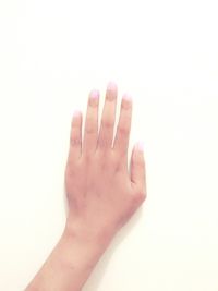 Close-up of hand over white background