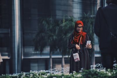 Close-up of woman standing on bench