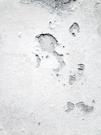 Close-up of footprints on sand