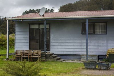 Exterior of house on field against sky