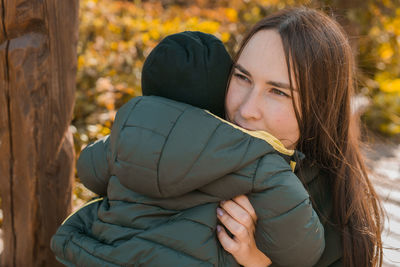 Close-up of young woman looking away