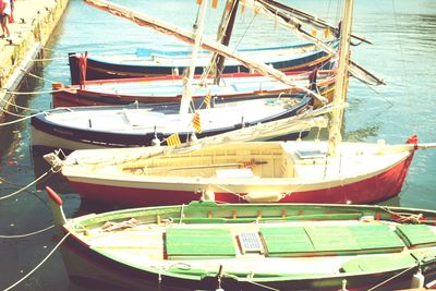 Boats moored at harbor