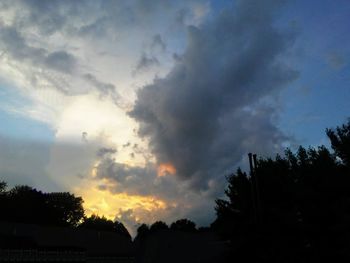 Low angle view of silhouette trees against sky during sunset