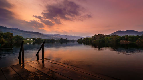 Scenic view of calm lake at sunset