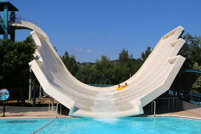 View of swimming pool against blue sky