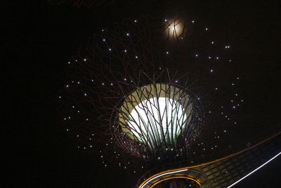 Low angle view of illuminated lights against sky