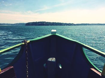 Boat sailing in sea against sky